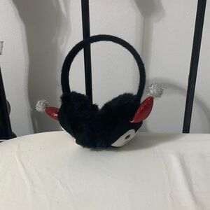 A penguin with a Santa hat on